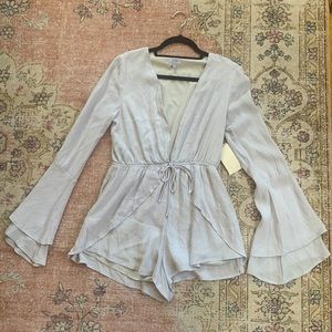 Tobi Long Sleeve Romper with deep v plunge and front tie size S
